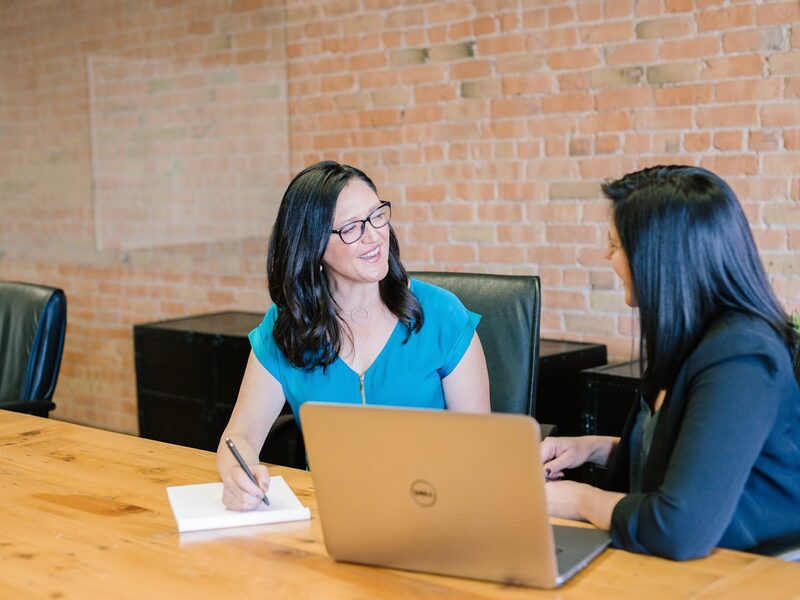 A sales representative reviewing service options one-on-one with a customer
